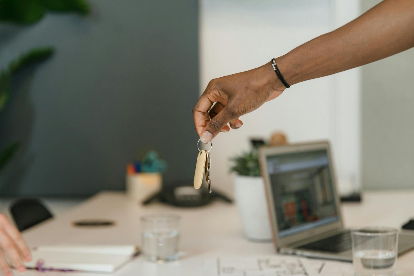 person handling keys in office